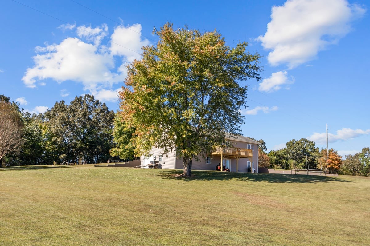 365 Little Benton Road Mansfield, TN 38236 - Photo 36 of 53 a front view of a house with a yard and lake view
