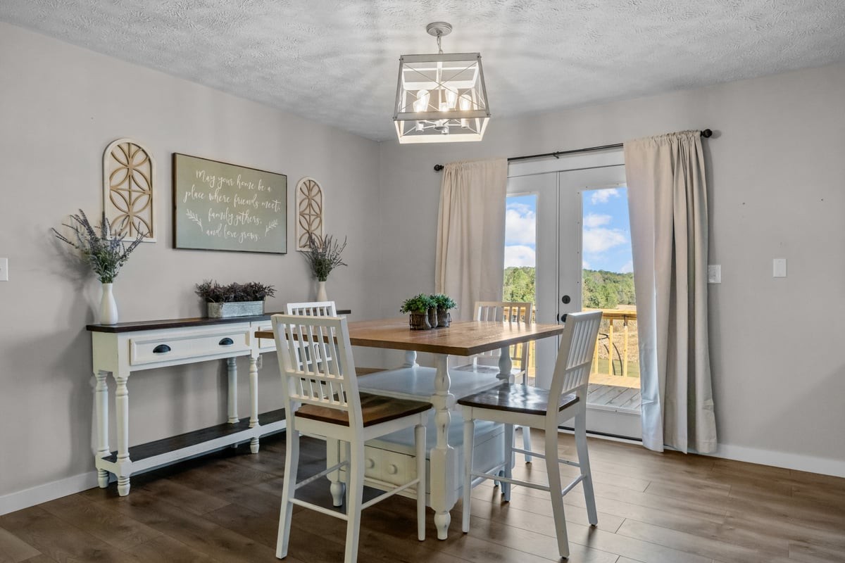 365 Little Benton Road Mansfield, TN 38236 - Photo 10 of 53 a view of a dining room with furniture window and wooden floor