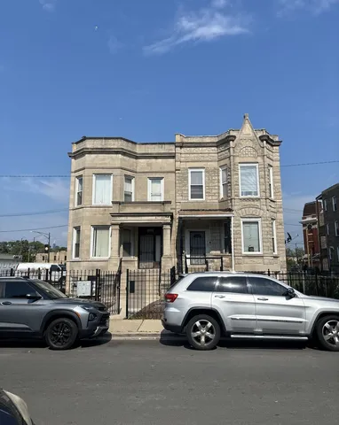 a view of a car parked in front of a house