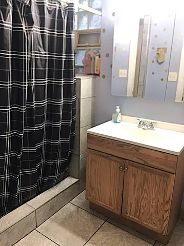 a bathroom with a sink and a mirror
