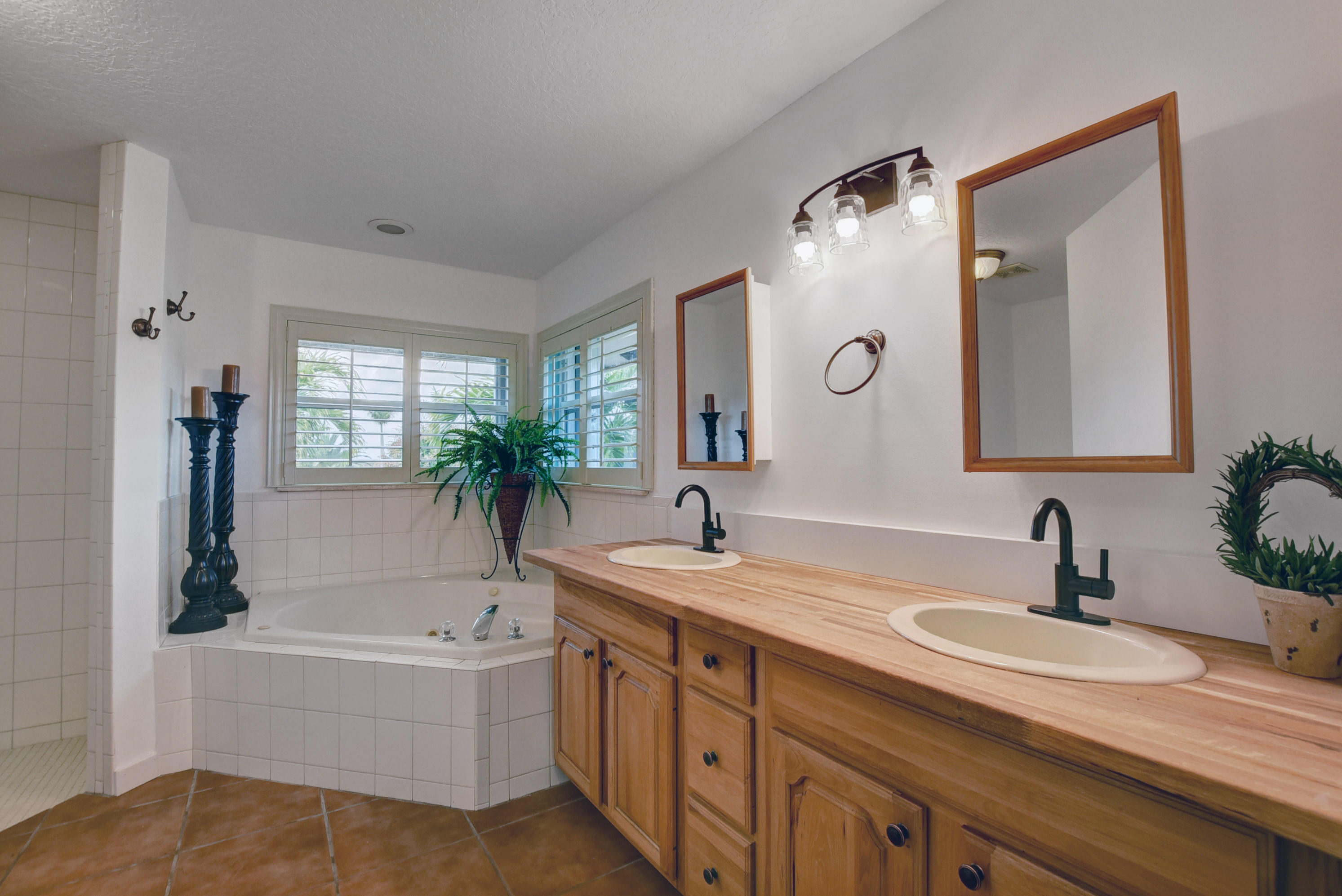 16493 Rustic Road Wellington, FL 33470 - Photo 16 of 57 a bathroom with a granite countertop sink mirror and a