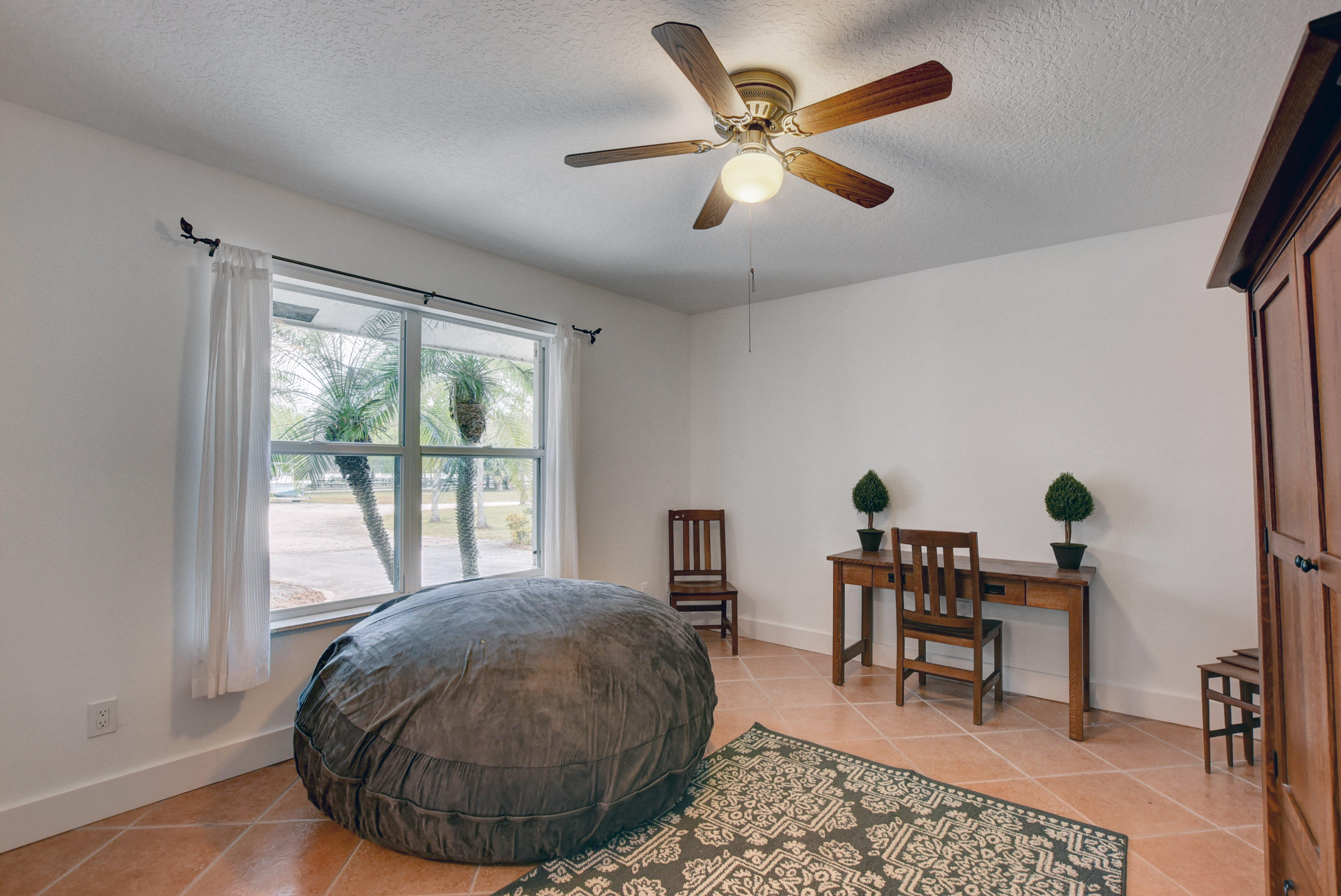 16493 Rustic Road Wellington, FL 33470 - Photo 18 of 57 a view of a livingroom with furniture and windows