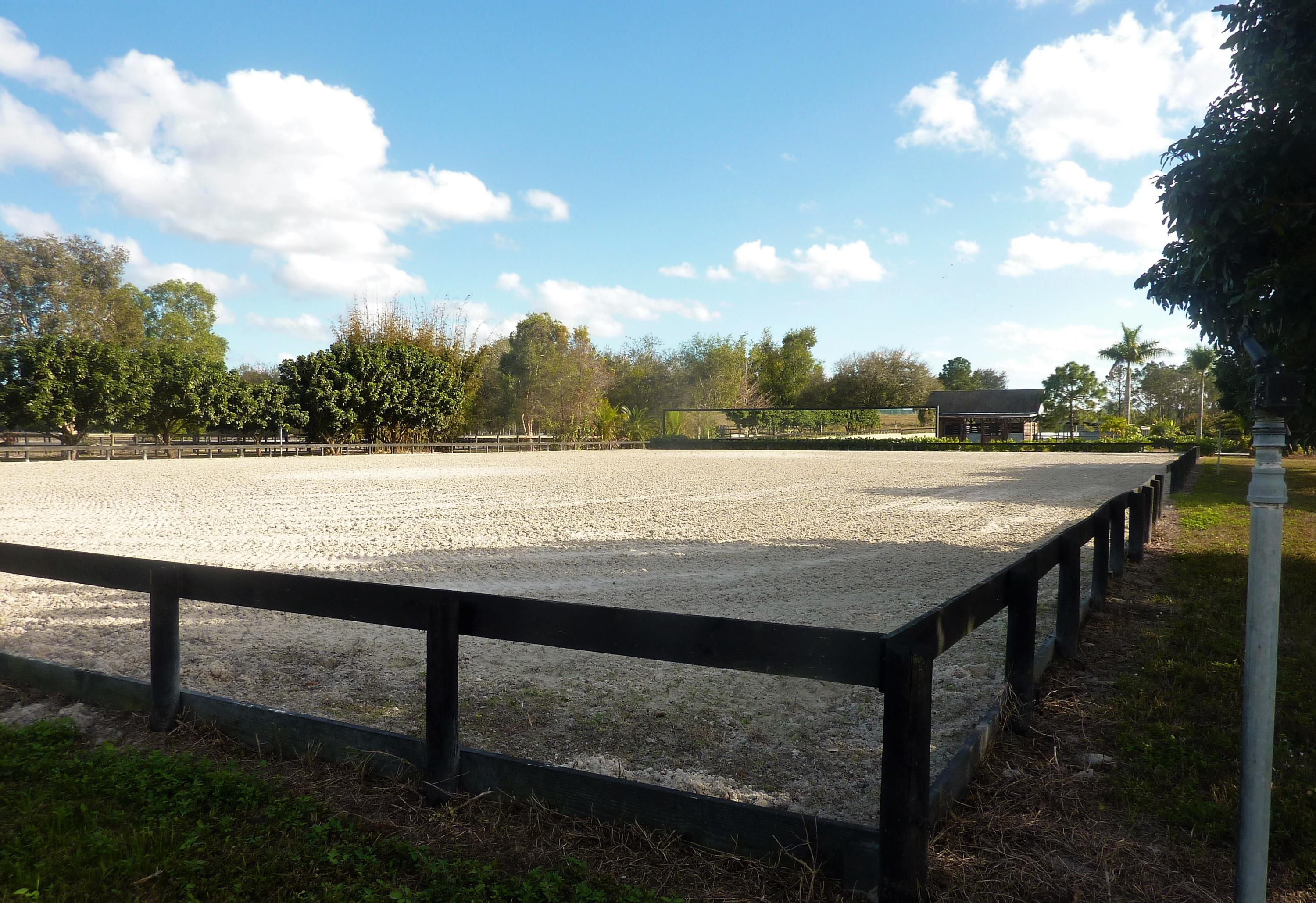 16493 Rustic Road Wellington, FL 33470 - Photo 33 of 57 a view of swimming pool with outdoor seating
