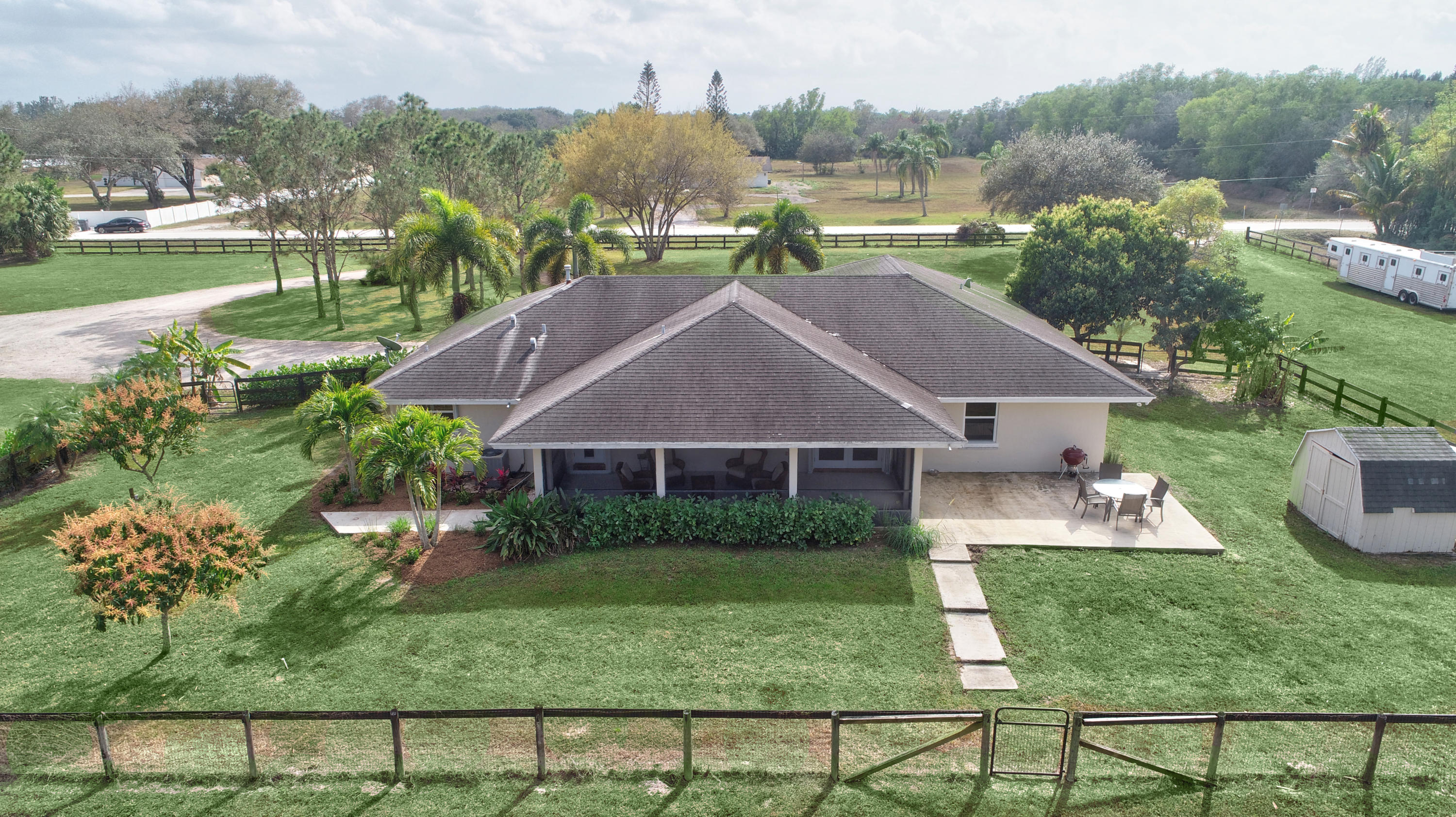 16493 Rustic Road Wellington, FL 33470 - Photo 34 of 57 a aerial view of a house with garden