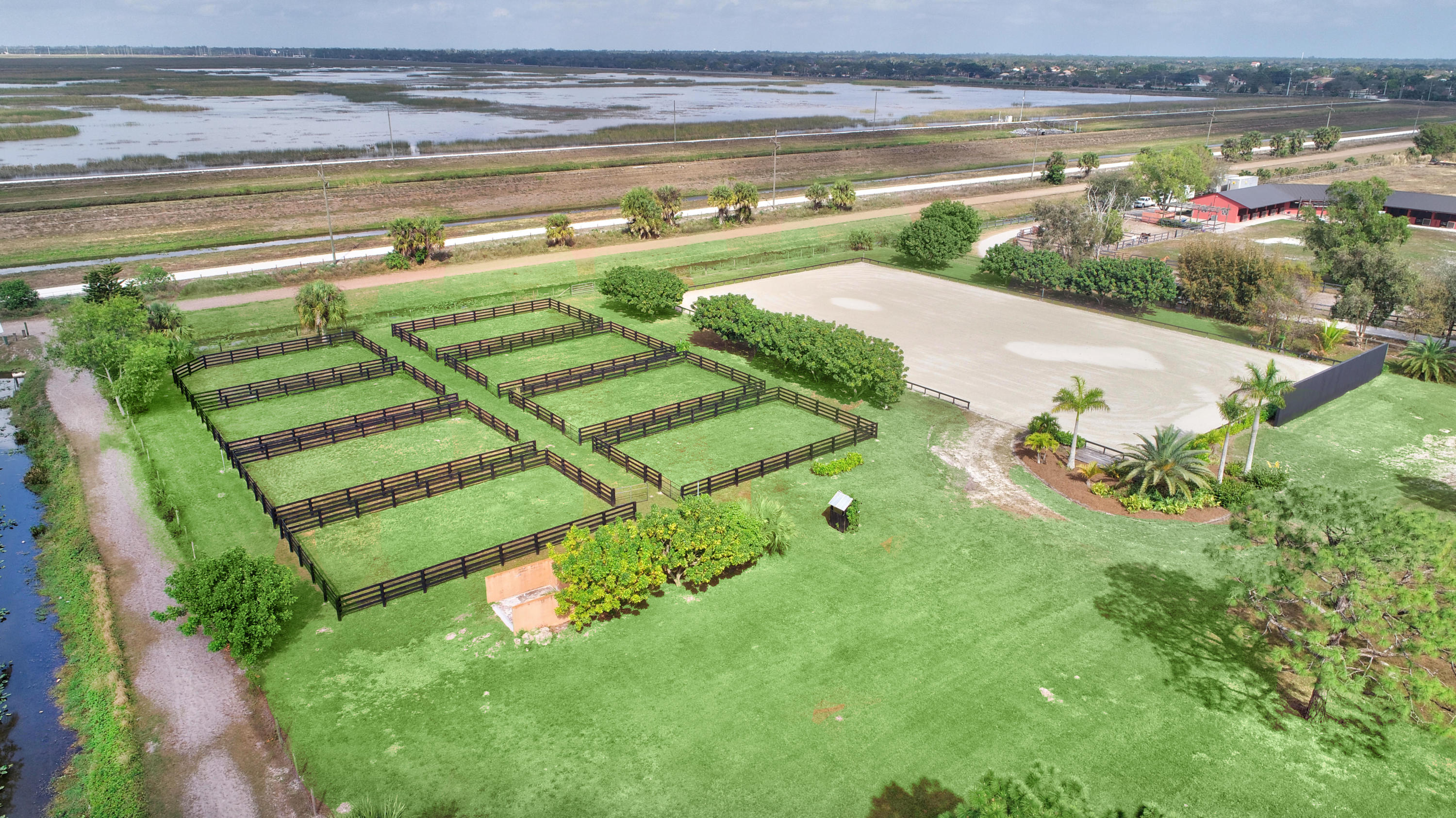 16493 Rustic Road Wellington, FL 33470 - Photo 37 of 57 a view of a swimming pool with a yard