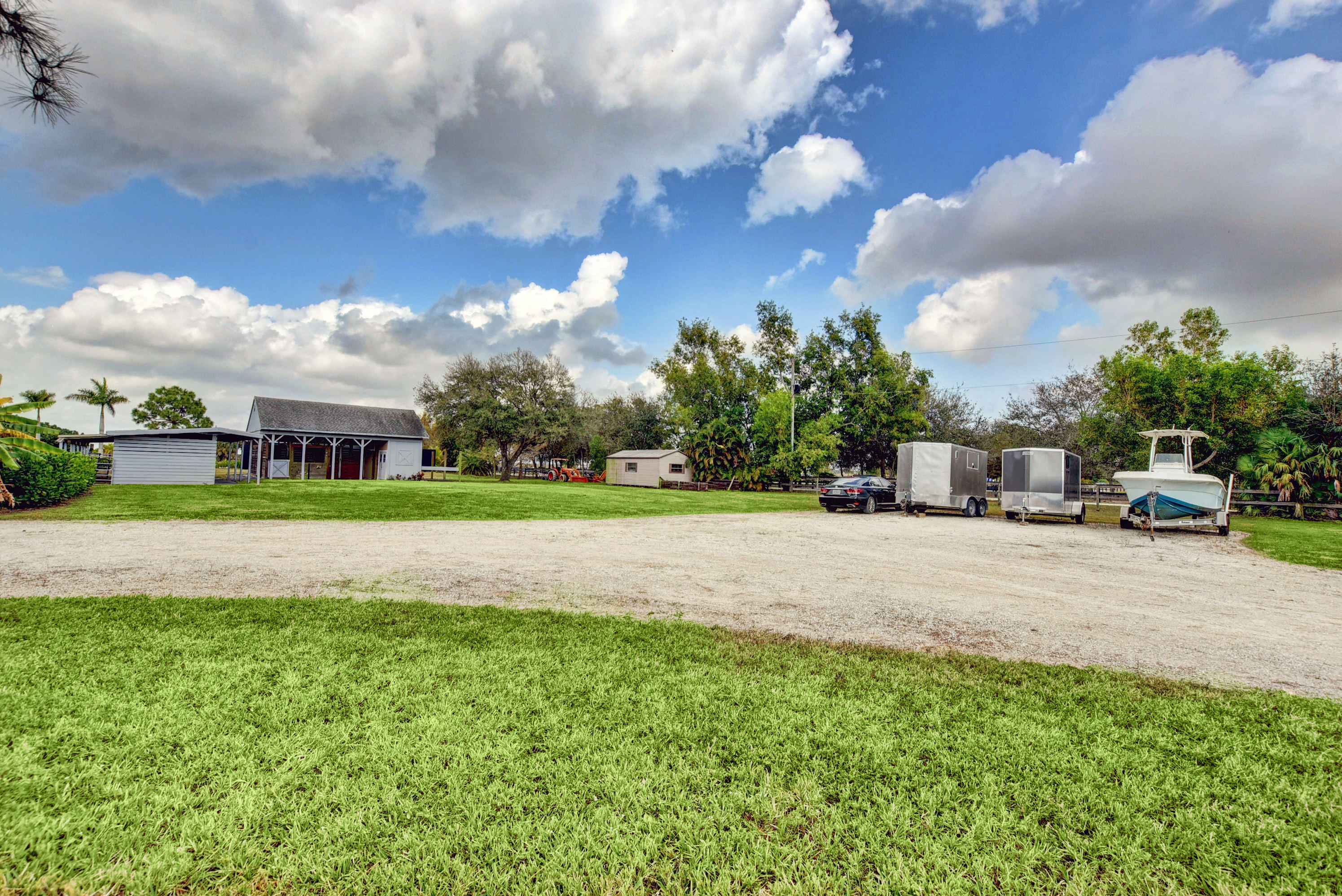 16493 Rustic Road Wellington, FL 33470 - Photo 41 of 57 a front view of house with yard