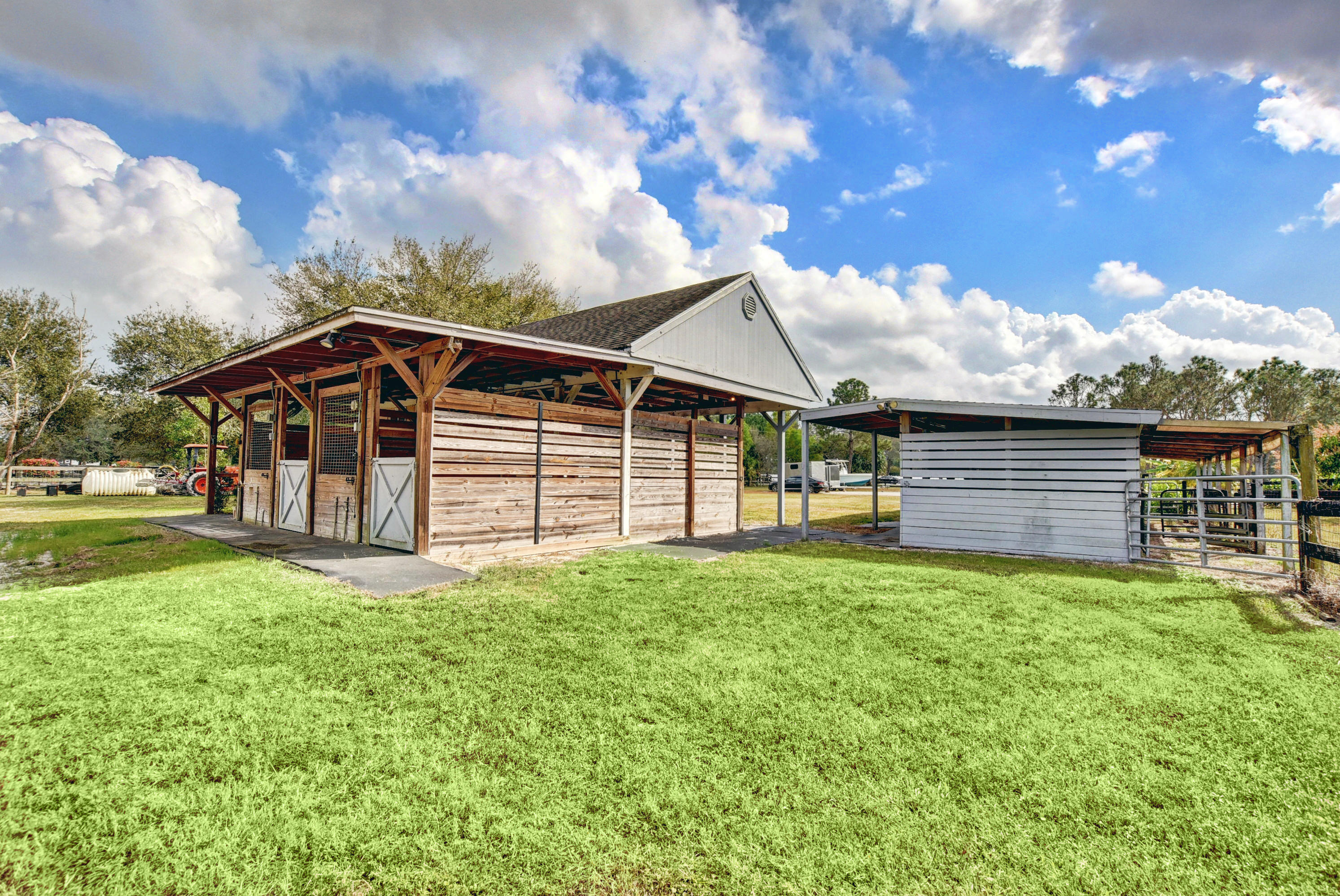16493 Rustic Road Wellington, FL 33470 - Photo 46 of 57 a view of a house with a yard