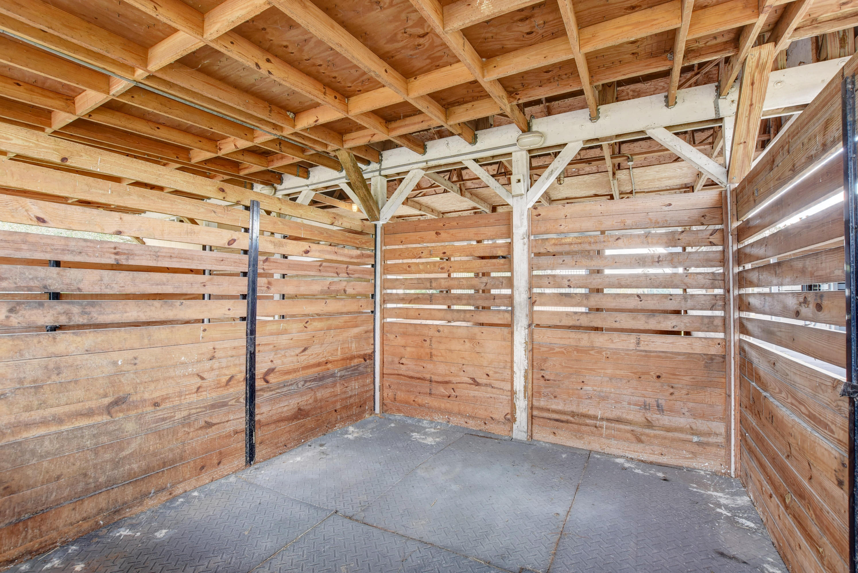 16493 Rustic Road Wellington, FL 33470 - Photo 48 of 57 a view of walk in closet with empty racks