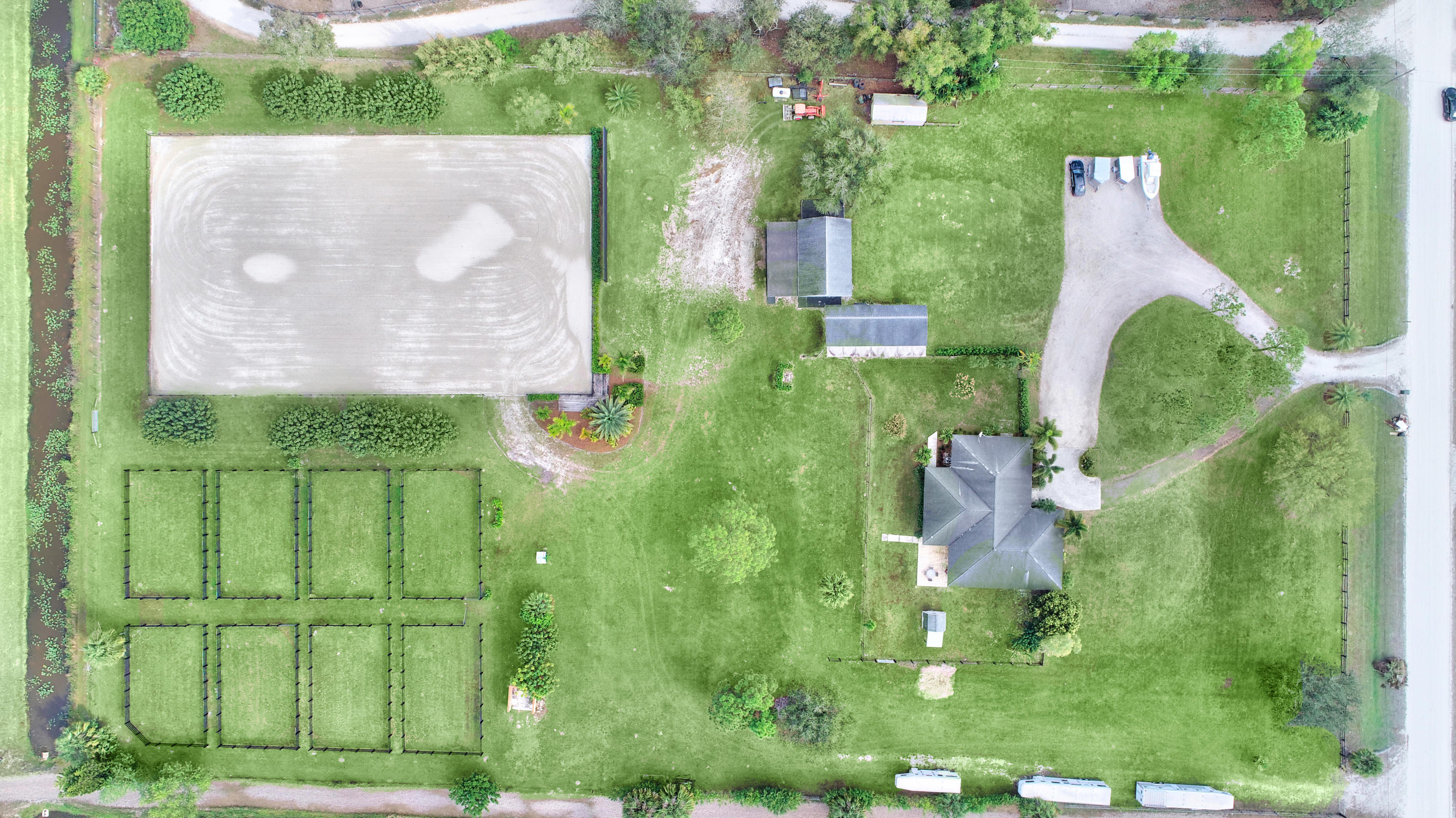 16493 Rustic Road Wellington, FL 33470 - Photo 57 of 57 an aerial view of a house with a yard and table and chairs