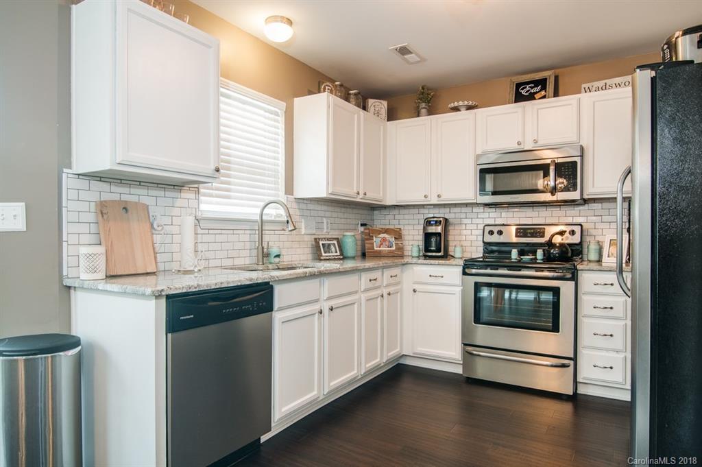 721 Jones Branch Road, Unit 75 Fort Mill, SC 29715 - Photo 17 of 36 a kitchen with granite countertop a sink and steel appliances