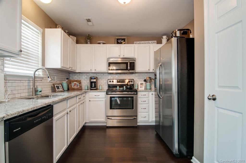 721 Jones Branch Road, Unit 75 Fort Mill, SC 29715 - Photo 20 of 36 a kitchen with stainless steel appliances and cabinets