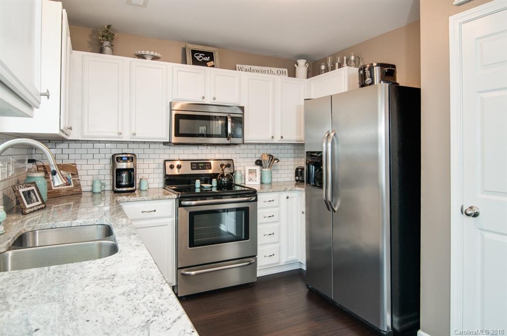 721 Jones Branch Road, Unit 75 Fort Mill, SC 29715 - Photo 21 of 36 a kitchen with stainless steel appliances granite countertop a refrigerator sink and stove