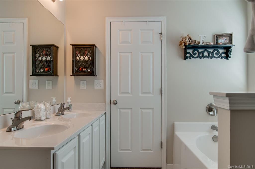721 Jones Branch Road, Unit 75 Fort Mill, SC 29715 - Photo 23 of 36 a bathroom with a sink and a mirror