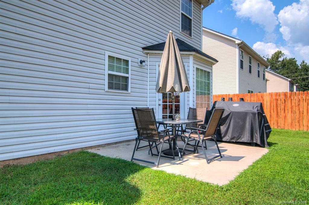 721 Jones Branch Road, Unit 75 Fort Mill, SC 29715 - Photo 36 of 36 a view of a patio with a table and chairs
