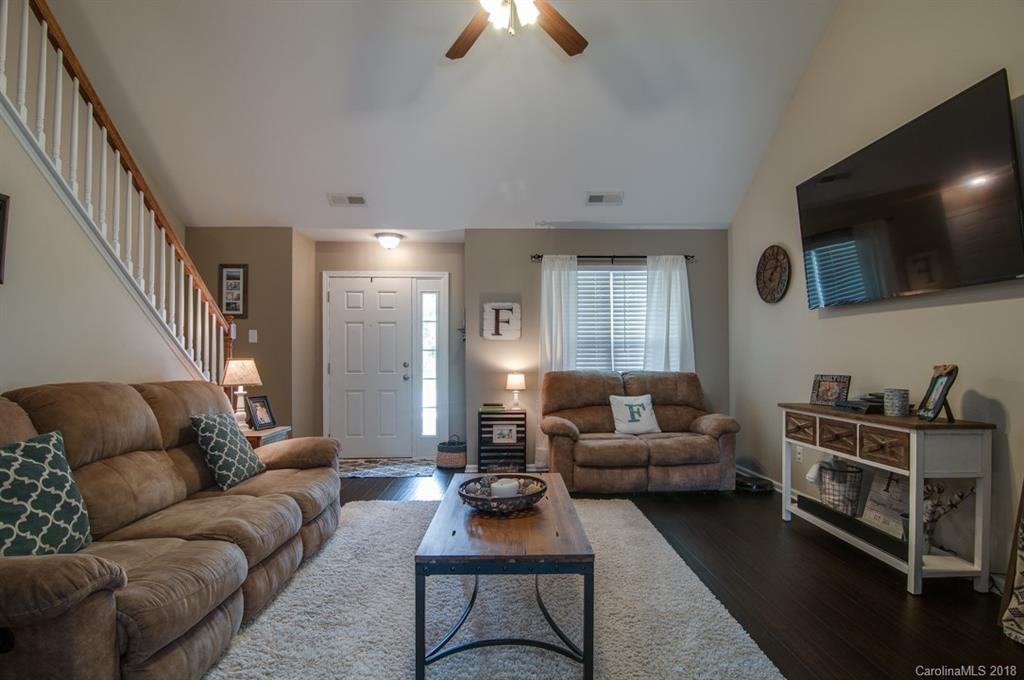 721 Jones Branch Road, Unit 75 Fort Mill, SC 29715 - Photo 8 of 36 a living room with furniture and a flat screen tv