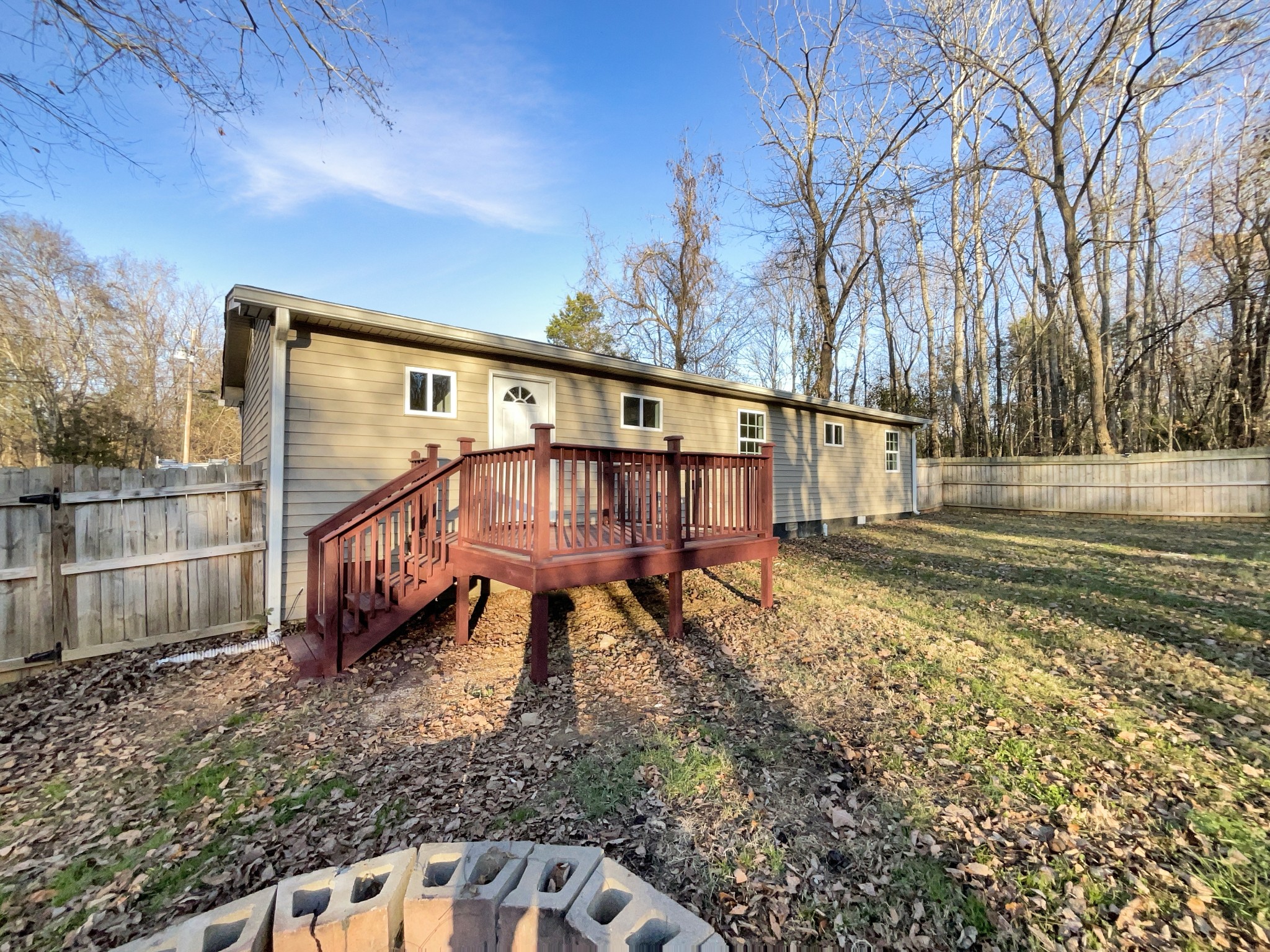 690 Thomas Road Lebanon, TN 37087 - Photo 16 of 17 a view of a house with a yard and wooden fence