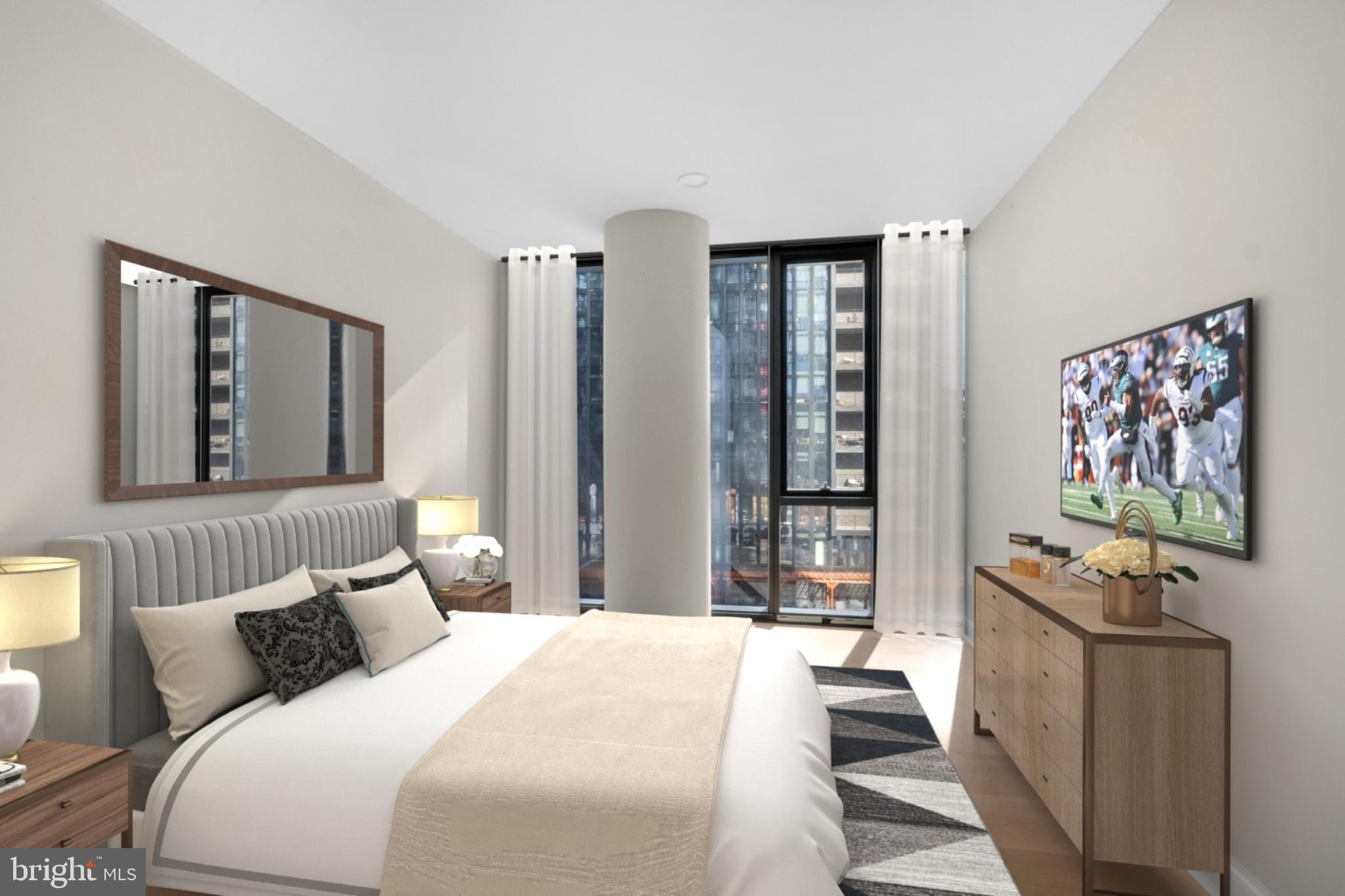 2301-61 John F Kennedy Boulevard, Unit 408 Philadelphia, PA 19103 - Photo 7 of 39 a bedroom with bed furniture and window