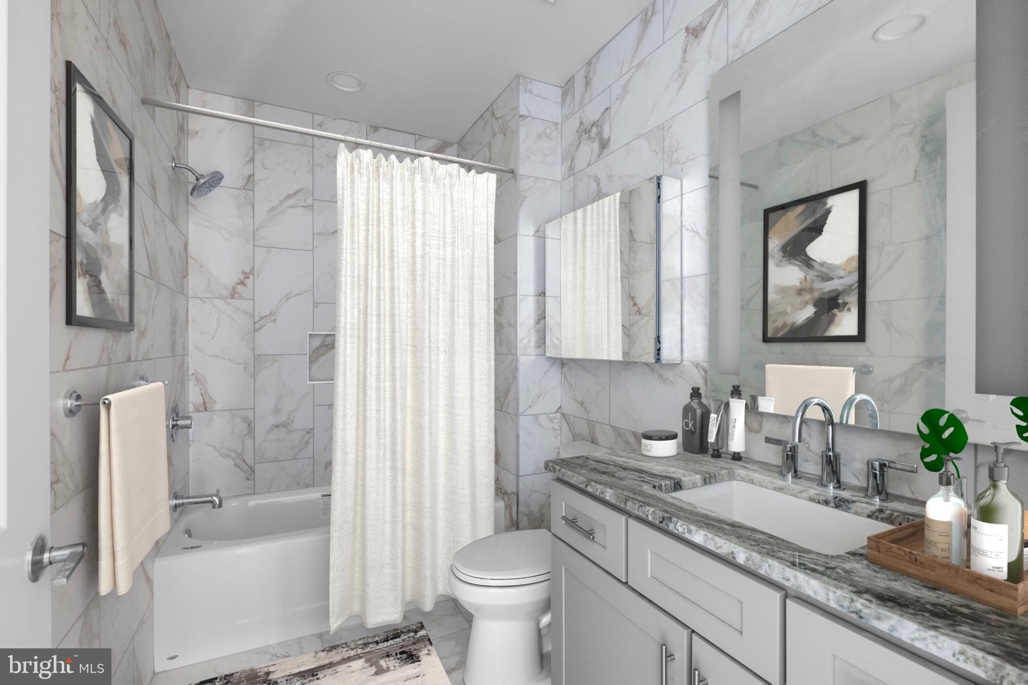 2301-61 John F Kennedy Boulevard, Unit 408 Philadelphia, PA 19103 - Photo 8 of 39 a bathroom with a granite countertop sink a toilet and shower