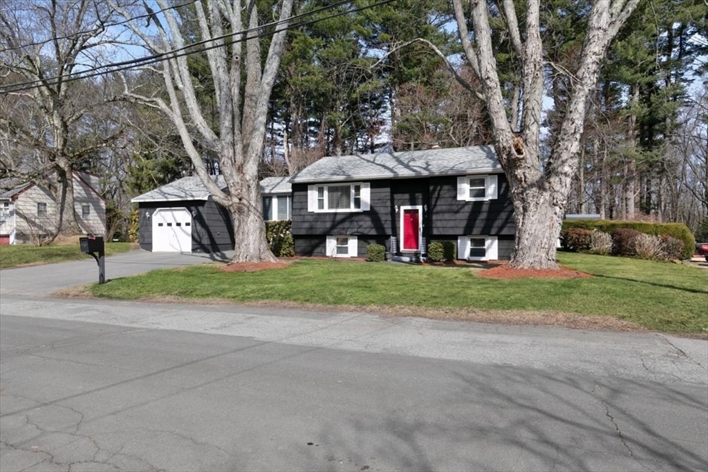 58 Oakcrest Circle Methuen, MA 01844 - Photo 38 of 41 a view of a house with a yard and large trees