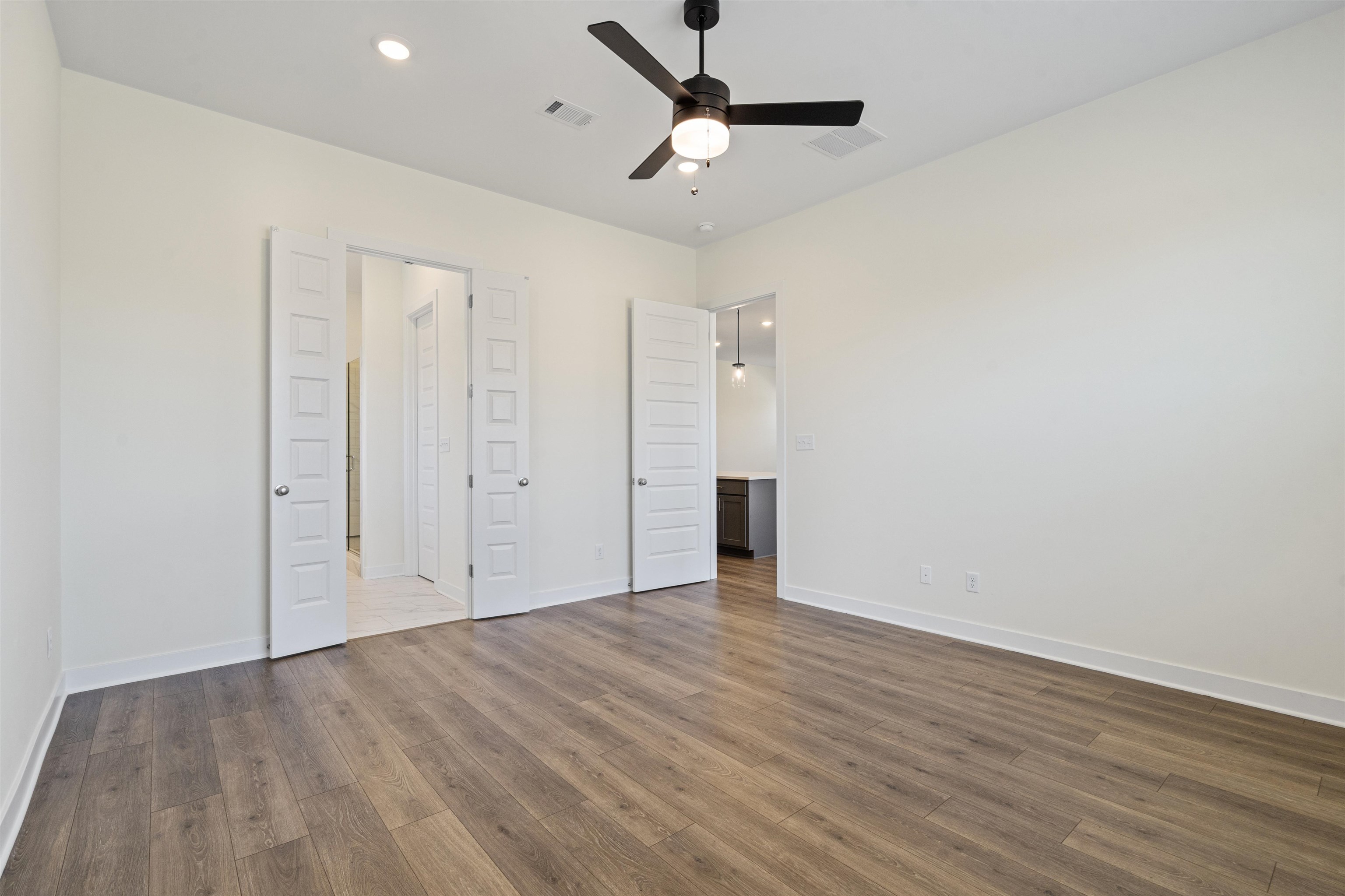 5666 Pleasant Pk Place Arlington, TN 38002 - Photo 19 of 27 Spacious room featuring wood-finish flooring, recessed lighting, and a ceiling fan with integrated light