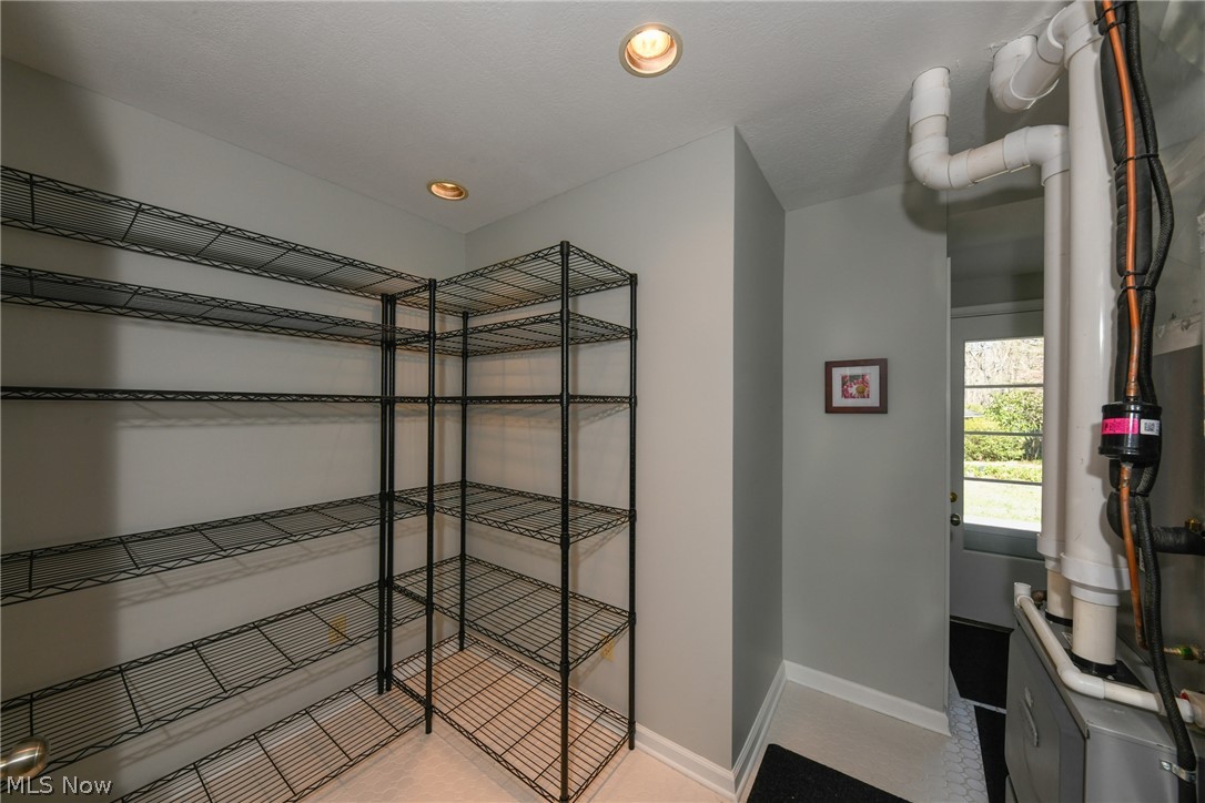 200 Hickory Road Akron, OH 44333 - Photo 28 of 35 Pantry area - new tiled floor new central air and high efficiency furnace