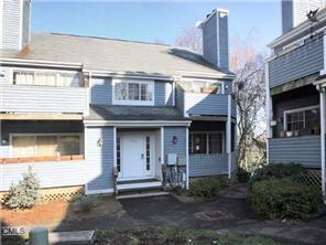 2 Spring Hill Avenue, Unit 10 Norwalk, CT 06850 - Photo 1 of 1 a front view of a house with garage
