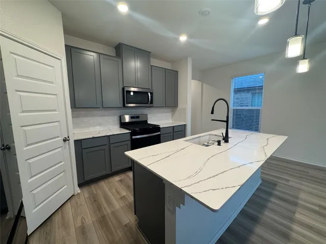 a view of entryway with wooden floor
