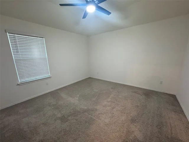 a bathroom with a sink a toilet and a shower