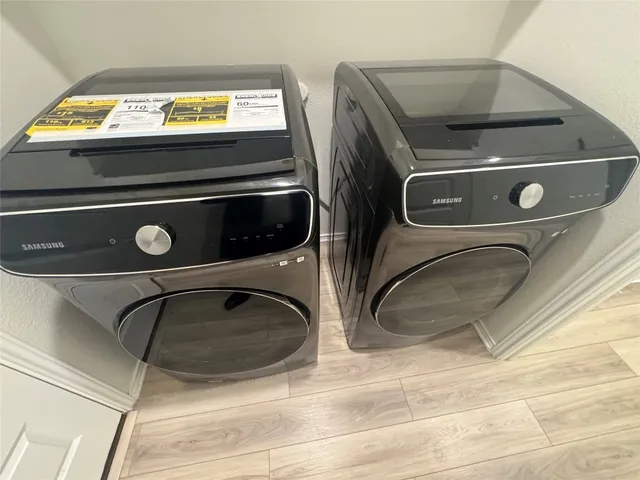 a utility room with washer and dryer