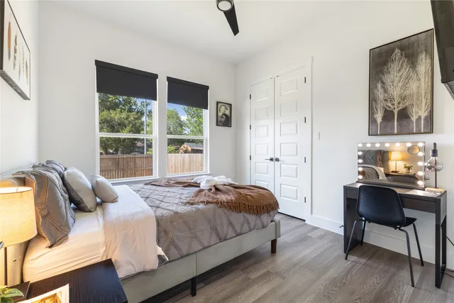 a bedroom with a bed and a desk