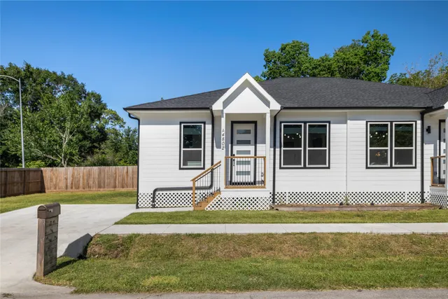 a view of house with a swimming pool