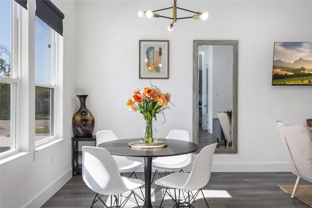 a dining room with furniture and window