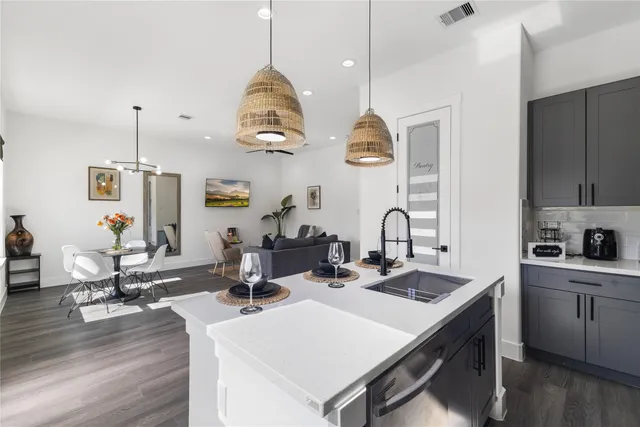 a kitchen with sink and stove