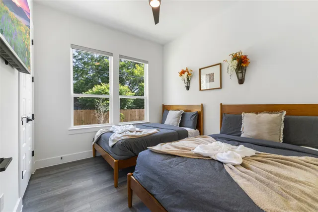 a bedroom with bed and a window