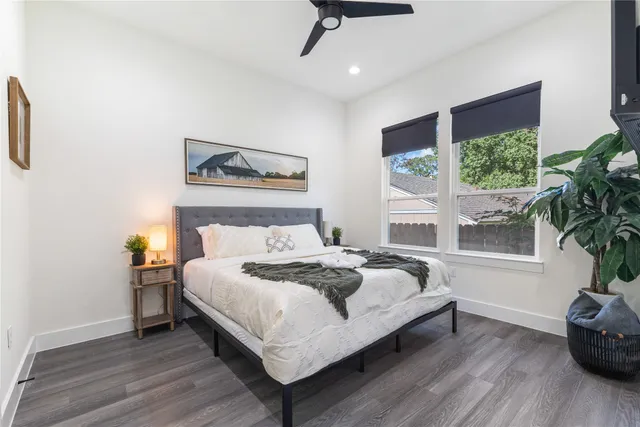 a bedroom with a bed and window