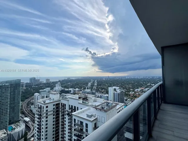 a view of a balcony with city view