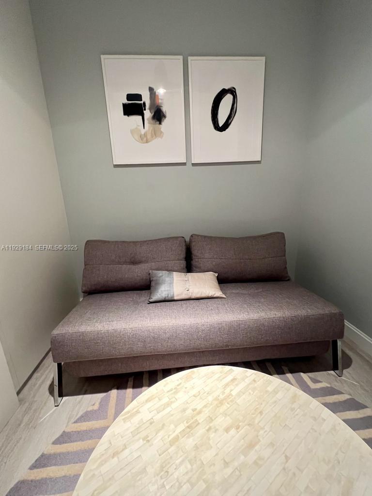 55 Southwest 9th Street, Unit 4205 Miami, FL 33130 - Photo 30 of 37 a living room with a couch