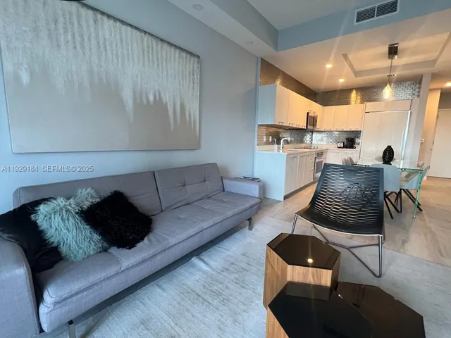 a bedroom with a bed and chair