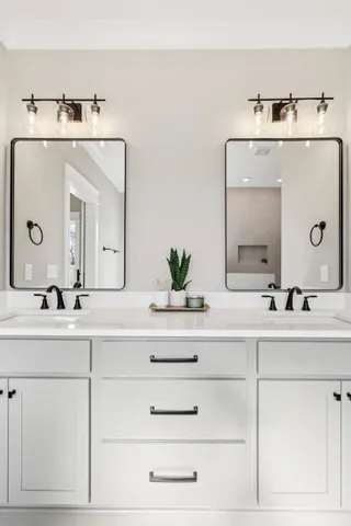 a white toilet sitting in a bathroom next to a window