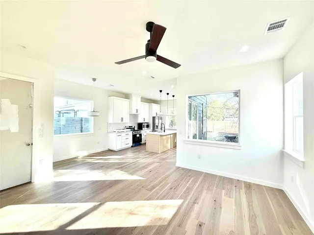 a view of a kitchen with a sink and a window