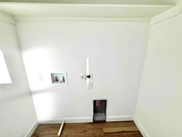 a view of a livingroom with wooden floor
