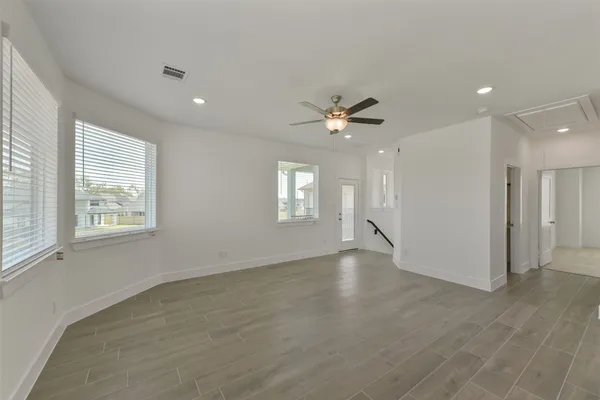 a view of an empty room with a window