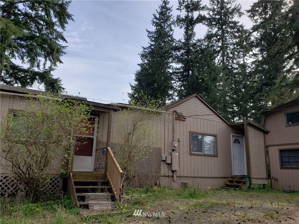 281 Chimacum Road Port Hadlock, WA 98339 - Photo 1 of 7 a view of a house with a yard