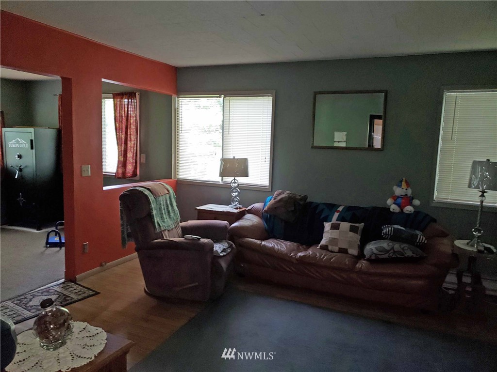 281 Chimacum Road Port Hadlock, WA 98339 - Photo 2 of 7 a living room with furniture and a window