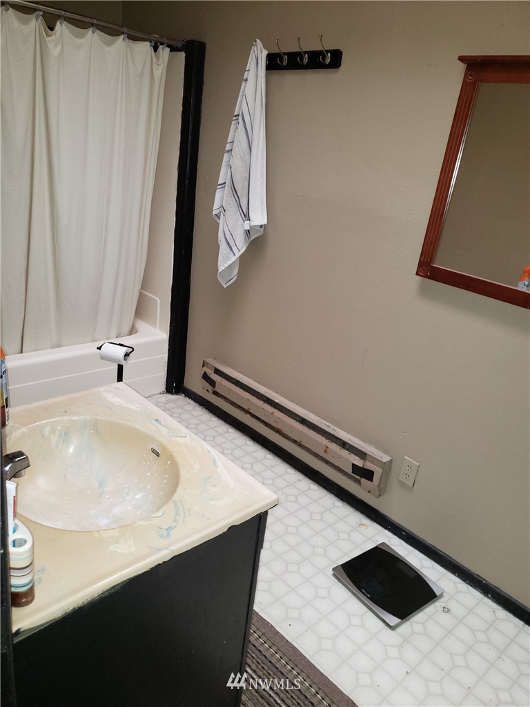 281 Chimacum Road Port Hadlock, WA 98339 - Photo 5 of 7 a bathroom with a sink and a mirror