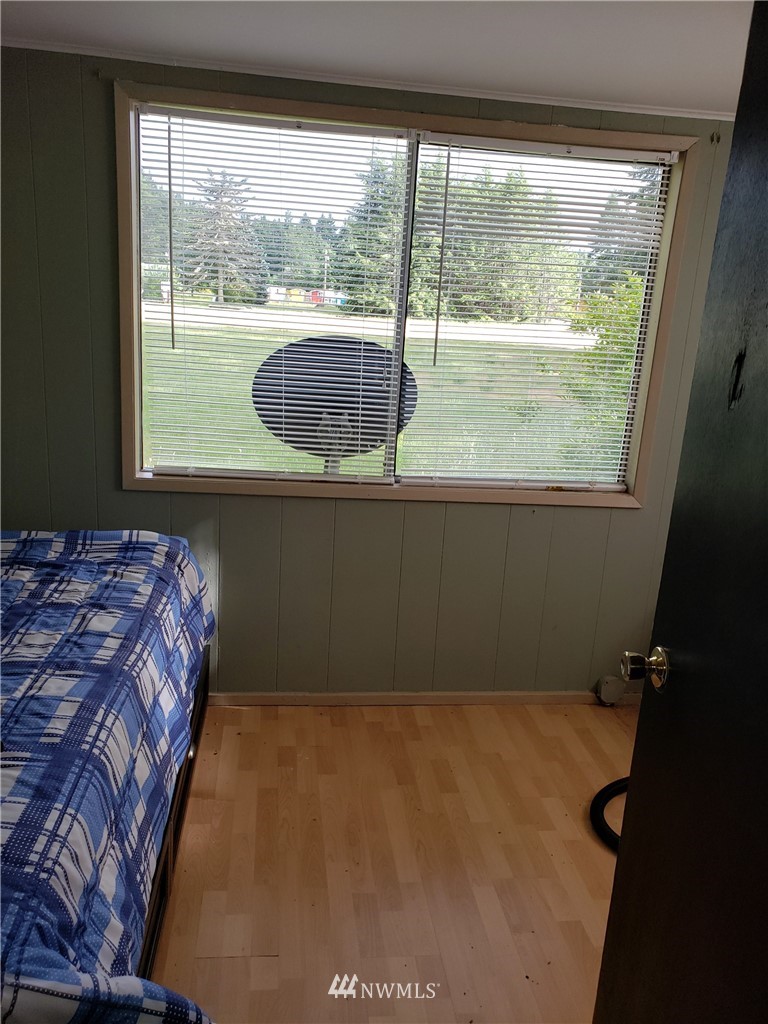 281 Chimacum Road Port Hadlock, WA 98339 - Photo 7 of 7 a bedroom with a bed and a window