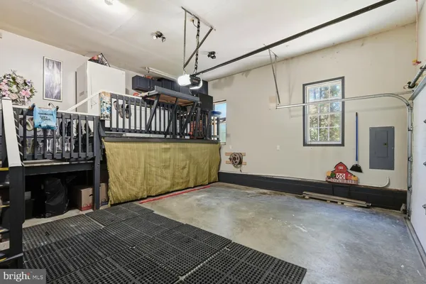 a view of a livingroom with furniture and staircase