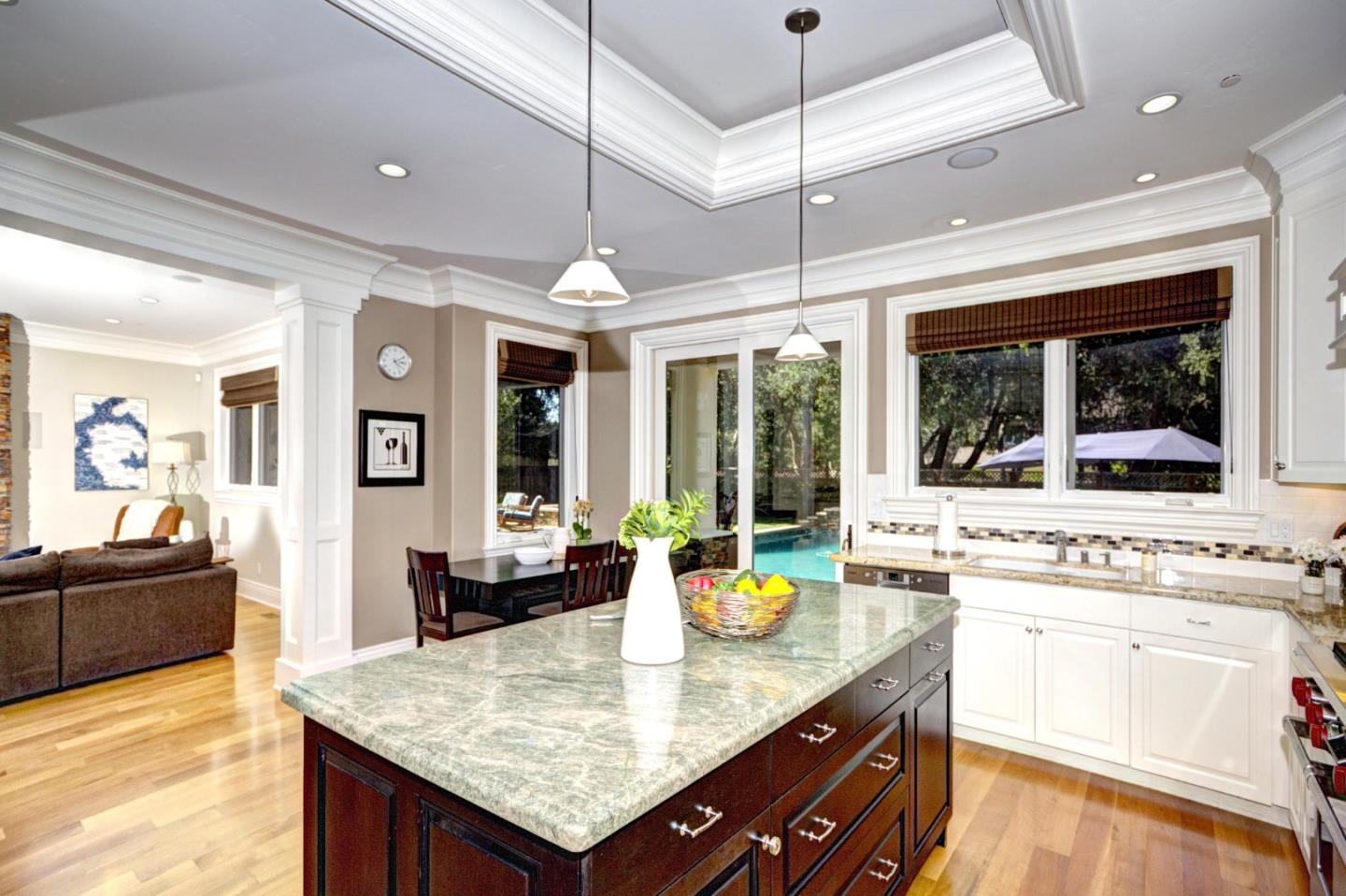 641 Mills Avenue Los Altos, CA 94022 - Photo 11 of 36 a kitchen with a stove kitchen island and living room
