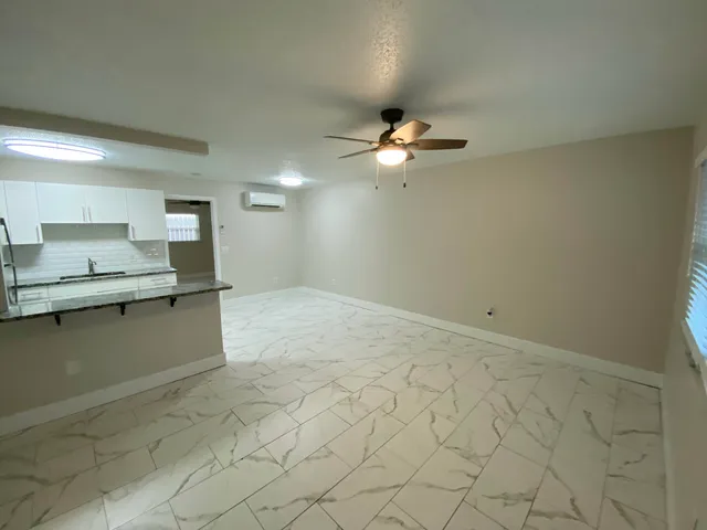 an empty room with a fireplace