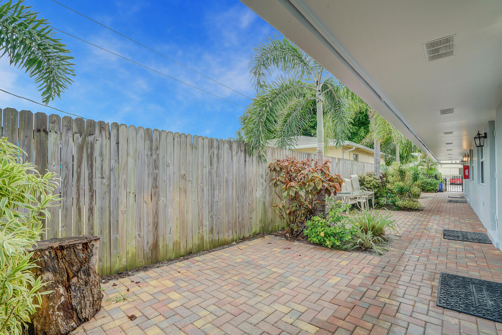 914 North Federal Highway, Unit 2 Lake Worth Beach, FL 33460 - Photo 13 of 13 a backyard of a house with plants and outdoor seating
